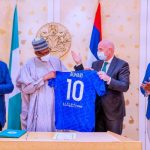 Buhari receives No. 10 jersey from FIFA president