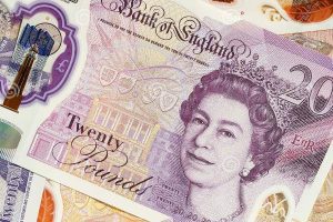 People in UK race to exchange paper banknotes before deadline
