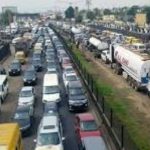 PROTESTERS BLOCK IBAFO SECTION OF THE LAGOS/IBADAN EXPRESSWAY OVER NAIRA SCARCITY