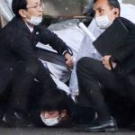 JAPAN PM SURVIVES SMOKEBOMB THROWN AT CAMPAIGN EVENT